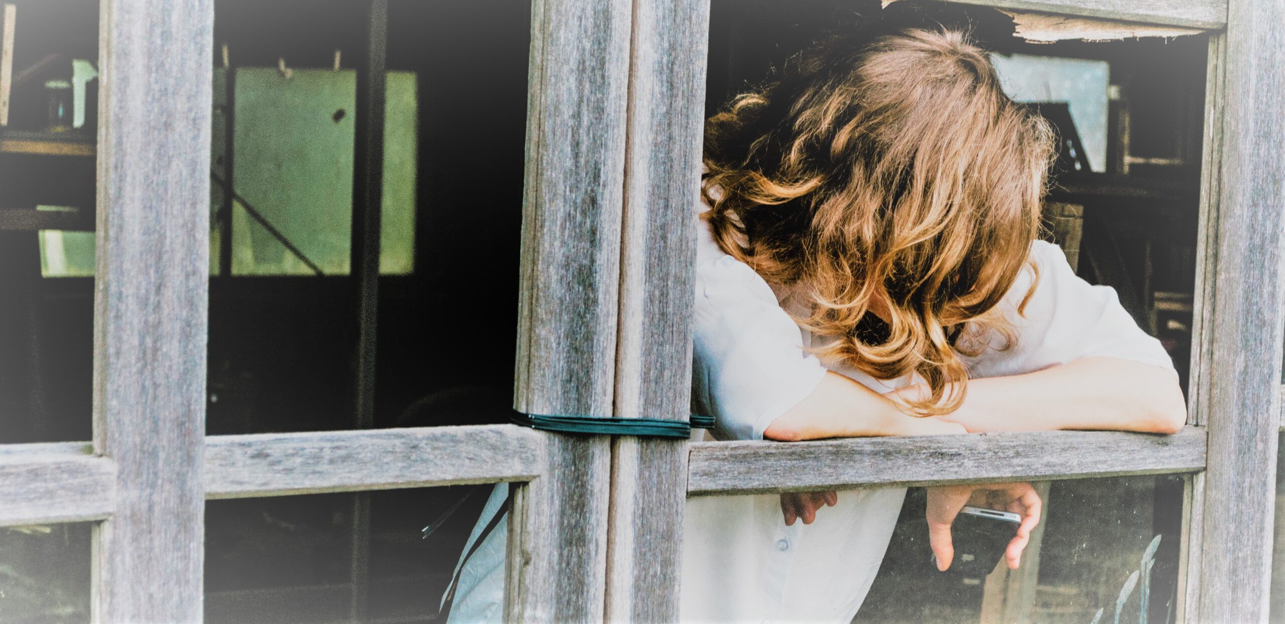 woman looking out of window