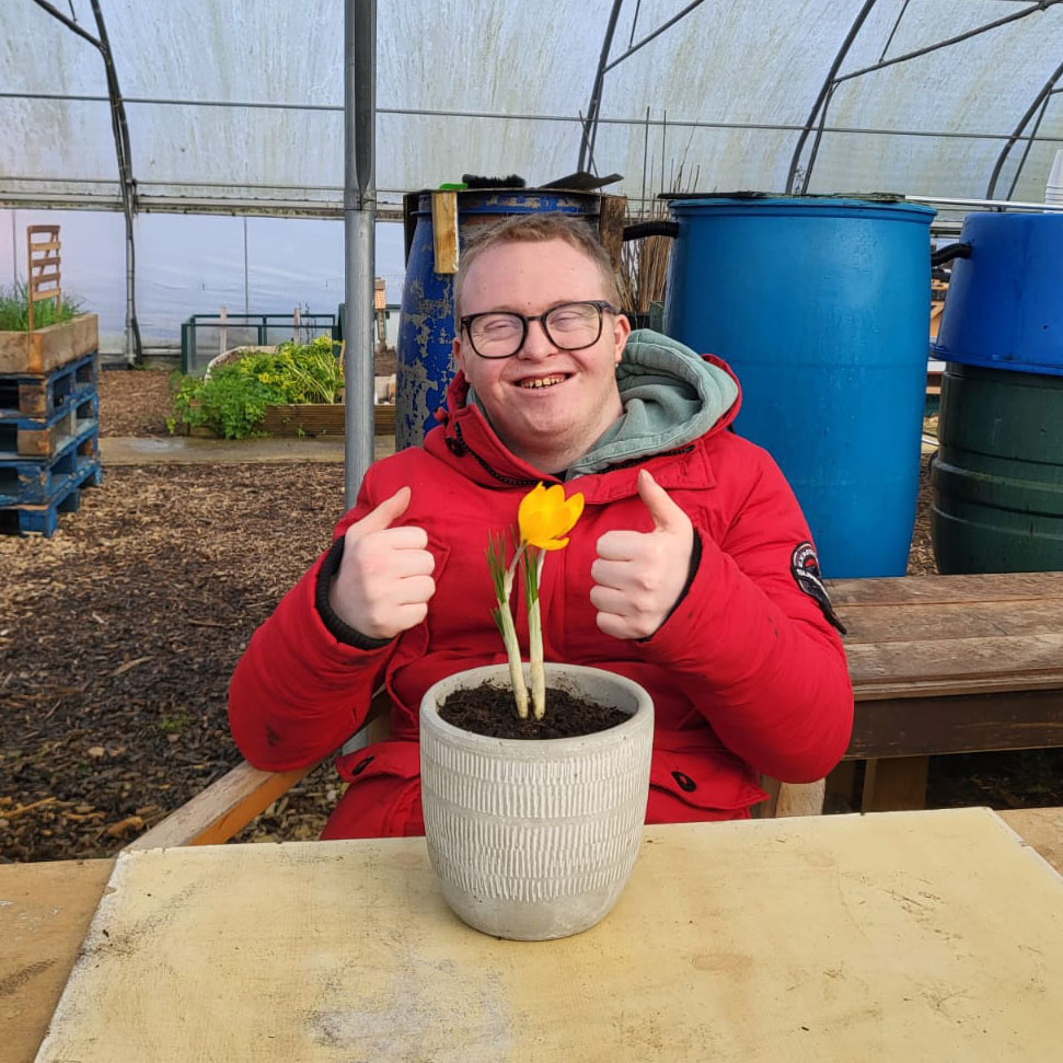 Flowers and smiles at Dig 'n' Grow Guideposts in Witney, Oxfordshire.