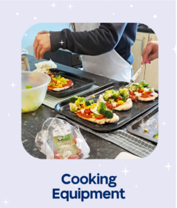 mini pizzas being made on a baking tray