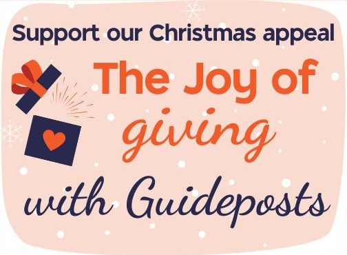 Graphic with snow in the background and text "Support our Christmas appeal, the Joy of giving with Guideposts" and a picture of a gift box