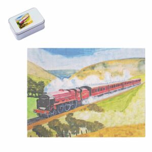a jigsaw of a steam train travelling through hills, together with a tin with the picture on the lid