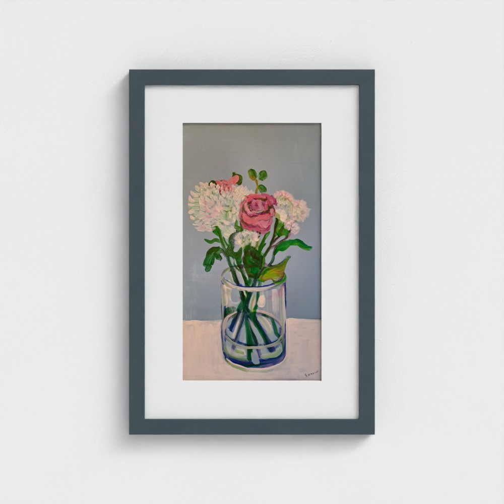 Framed painting of flowers in a vase. There is 1 pink rose, and other white flowers. The vase is glass with blue